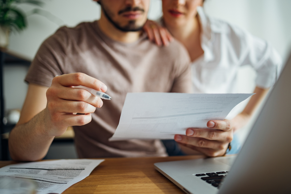 couple looking over finances to buy a house
