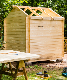 The building process of a wood shed