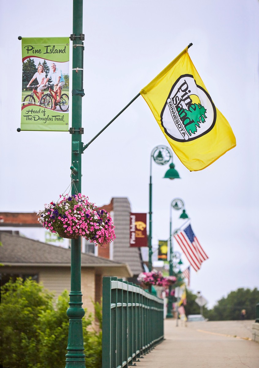 pine island city flag flowing in sky