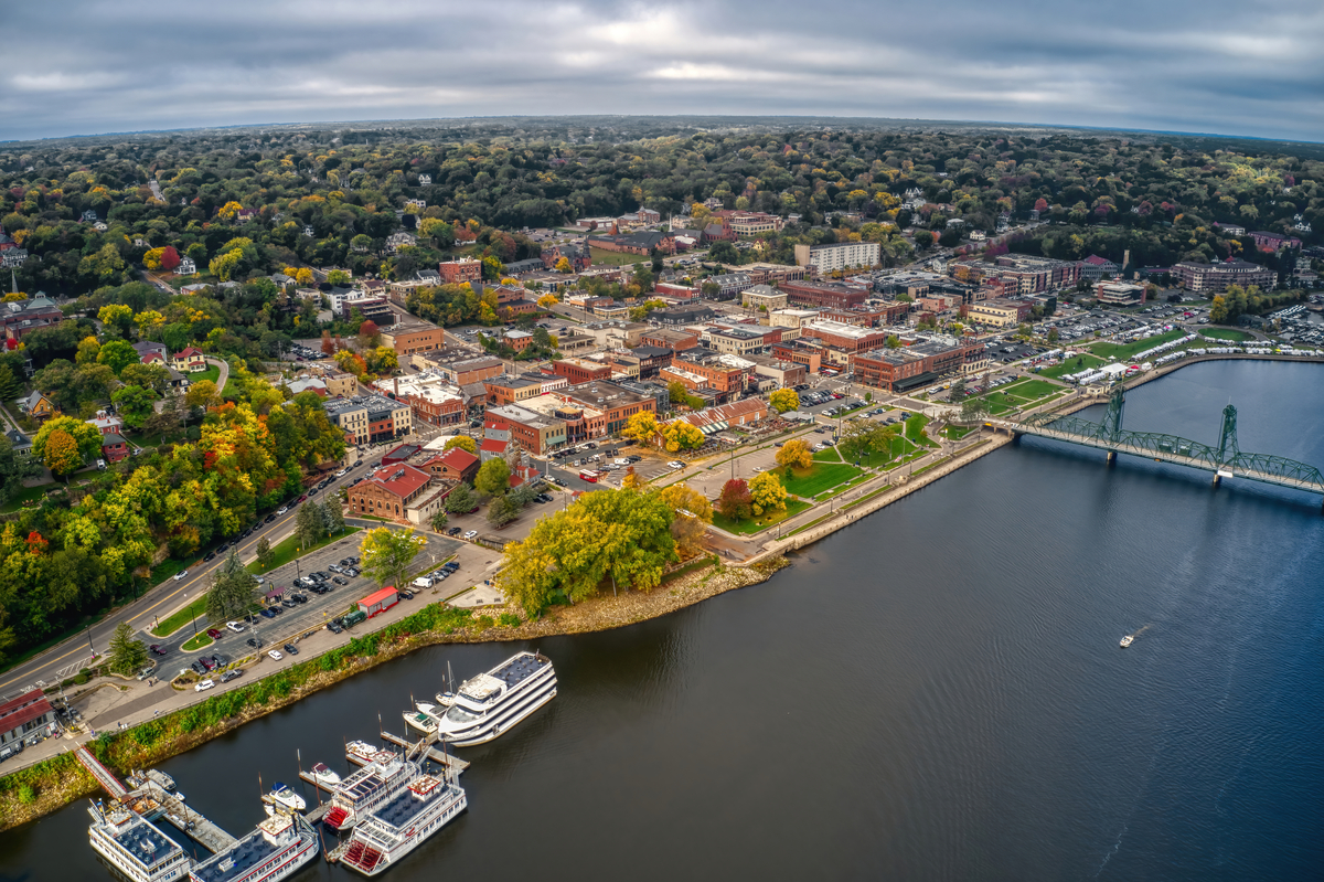 Aerial view of Stillwater, Minnesota with riverboats, fall trees and the lift bridge.